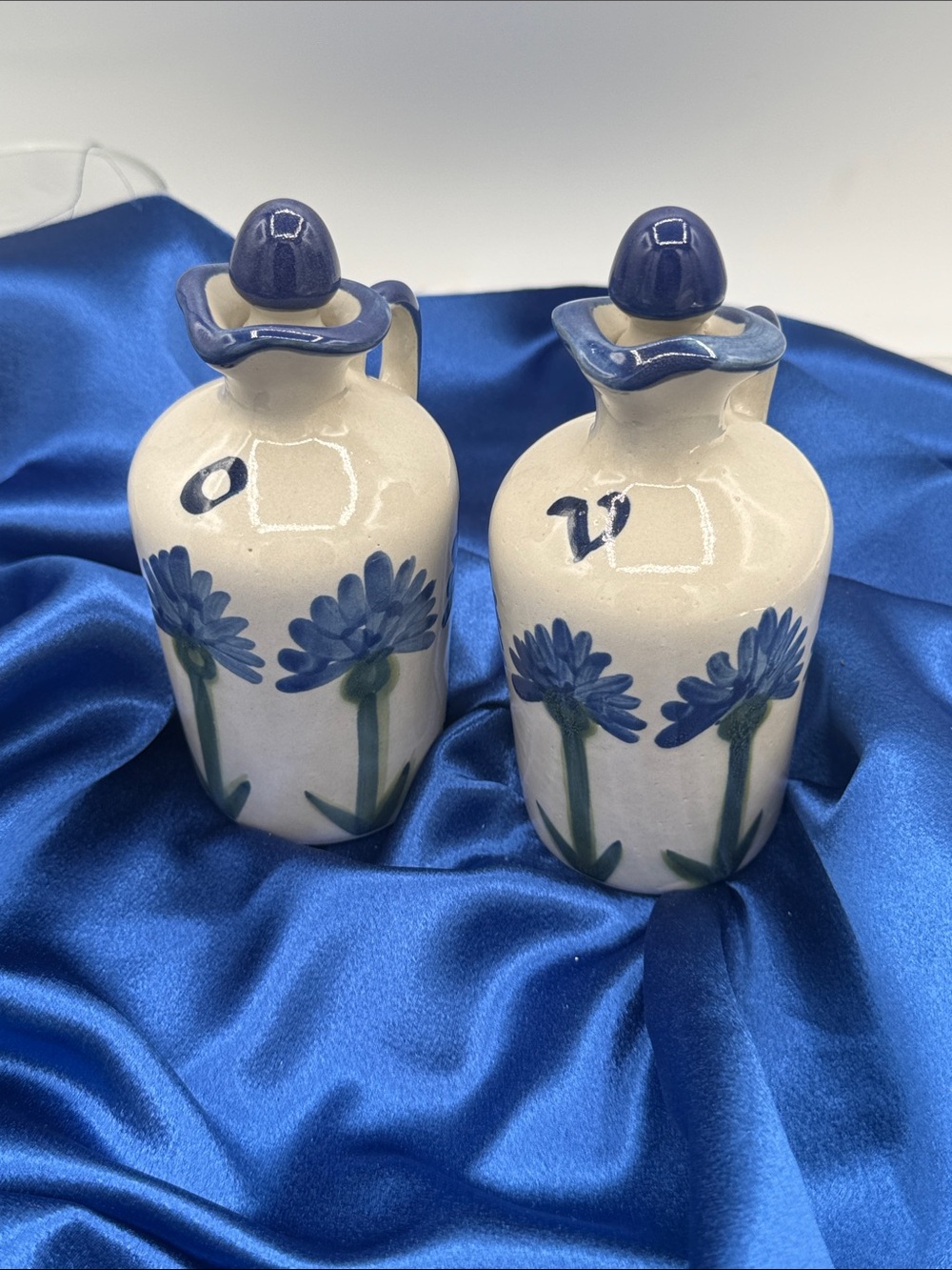 A vintage Oil and Vinegar set from Louisville Stoneware; Bachelor Button pattern